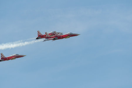 Mollis, Switzerland, August 18, 2023 Patrouille Suisse Northrop F-5E Tiger II military jet doing acrobatic flights during an air displayのeditorial素材