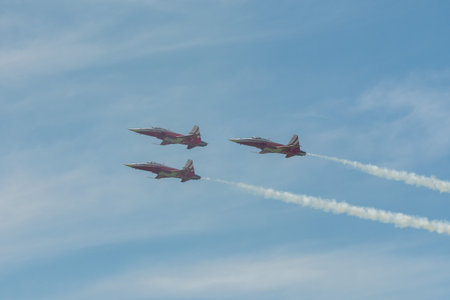 Mollis, Switzerland, August 18, 2023 Patrouille Suisse Northrop F-5E Tiger II military jet doing acrobatic flights during an air displayのeditorial素材