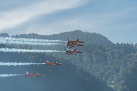 Mollis, Switzerland, August 18, 2023 Patrouille Suisse Northrop F-5E Tiger II military jet doing acrobatic flights during an air displayのeditorial素材