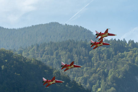 Mollis, Switzerland, August 18, 2023 Patrouille Suisse Northrop F-5E Tiger II military jet doing acrobatic flights during an air displayのeditorial素材