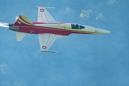 Mollis, Switzerland, August 18, 2023 Patrouille Suisse Northrop F-5E Tiger II military jet doing acrobatic flights during an air displayのeditorial素材