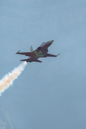 Mollis, Switzerland, August 18, 2023 Patrouille Suisse Northrop F-5E Tiger II military jet doing acrobatic flights during an air displayのeditorial素材