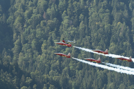 Mollis, Switzerland, August 18, 2023 Patrouille Suisse F-5E Tiger II escorted with a P-51D Mustang during an air displayのeditorial素材