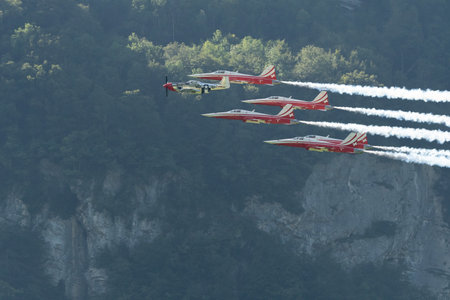 Mollis, Switzerland, August 18, 2023 Patrouille Suisse F-5E Tiger II escorted with a P-51D Mustang during an air displayのeditorial素材