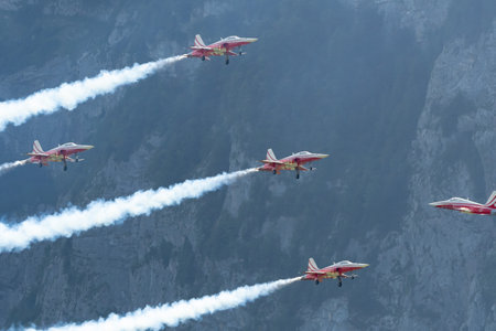 Mollis, Switzerland, August 18, 2023 Patrouille Suisse Northrop F-5E Tiger II military jet doing acrobatic flights during an air displayのeditorial素材