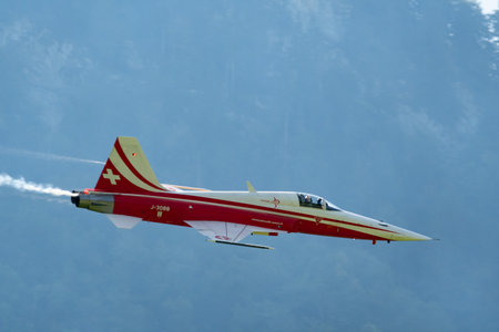 Mollis, Switzerland, August 18, 2023 Patrouille Suisse Northrop F-5E Tiger II military jet doing acrobatic flights during an air displayのeditorial素材