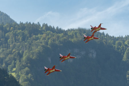 Mollis, Switzerland, August 18, 2023 Patrouille Suisse Northrop F-5E Tiger II military jet doing acrobatic flights during an air displayのeditorial素材