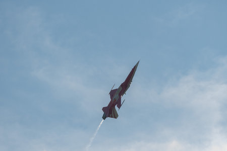 Mollis, Switzerland, August 18, 2023 Patrouille Suisse Northrop F-5E Tiger II military jet doing acrobatic flights during an air displayのeditorial素材