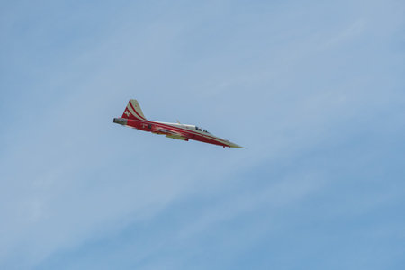 Mollis, Switzerland, August 18, 2023 Patrouille Suisse Northrop F-5E Tiger II military jet doing acrobatic flights during an air displayのeditorial素材