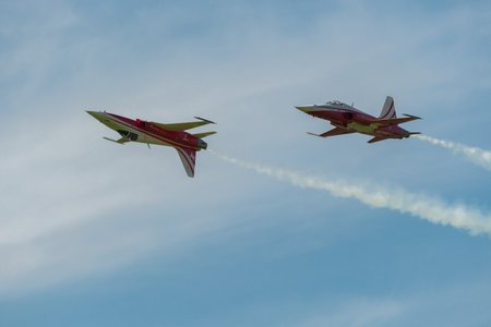 Mollis, Switzerland, August 18, 2023 Patrouille Suisse Northrop F-5E Tiger II military jet doing acrobatic flights during an air displayのeditorial素材