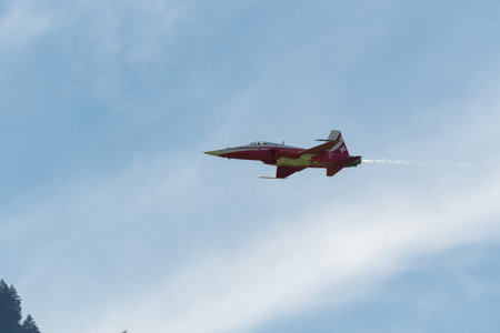 Mollis, Switzerland, August 18, 2023 Patrouille Suisse Northrop F-5E Tiger II military jet doing acrobatic flights during an air displayのeditorial素材