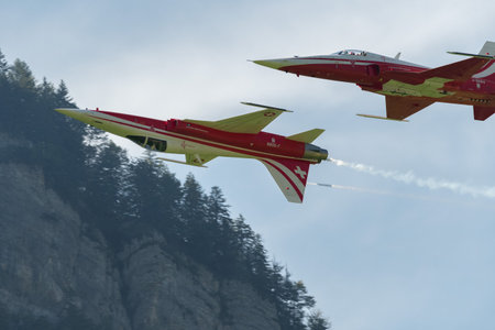 Mollis, Switzerland, August 18, 2023 Patrouille Suisse Northrop F-5E Tiger II military jet doing acrobatic flights during an air displayのeditorial素材