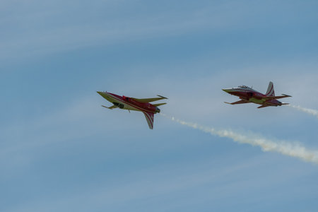 Mollis, Switzerland, August 18, 2023 Patrouille Suisse Northrop F-5E Tiger II military jet doing acrobatic flights during an air displayのeditorial素材