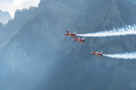 Mollis, Switzerland, August 18, 2023 Patrouille Suisse Northrop F-5E Tiger II military jet doing acrobatic flights during an air displayのeditorial素材