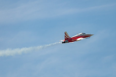 Mollis, Switzerland, August 18, 2023 Patrouille Suisse Northrop F-5E Tiger II military jet doing acrobatic flights during an air displayのeditorial素材