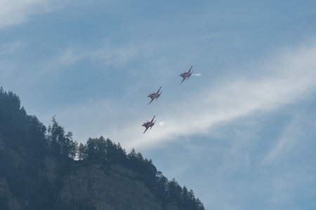 Mollis, Switzerland, August 18, 2023 Patrouille Suisse Northrop F-5E Tiger II military jet doing acrobatic flights during an air displayのeditorial素材