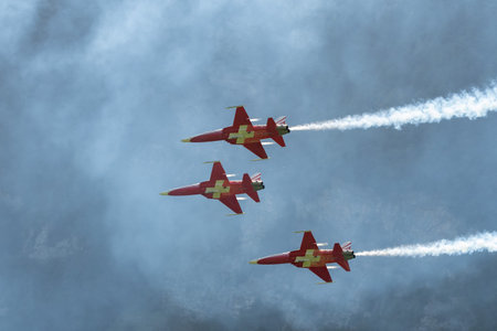 Mollis, Switzerland, August 18, 2023 Patrouille Suisse Northrop F-5E Tiger II military jet doing acrobatic flights during an air displayのeditorial素材