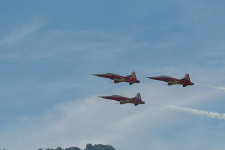 Mollis, Switzerland, August 18, 2023 Patrouille Suisse Northrop F-5E Tiger II military jet doing acrobatic flights during an air displayのeditorial素材