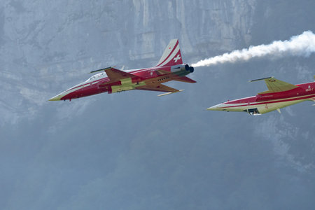 Mollis, Switzerland, August 18, 2023 Patrouille Suisse Northrop F-5E Tiger II military jet doing acrobatic flights during an air displayのeditorial素材