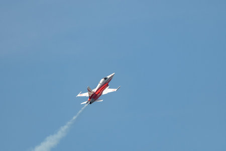 Mollis, Switzerland, August 18, 2023 Patrouille Suisse Northrop F-5E Tiger II military jet doing acrobatic flights during an air displayのeditorial素材