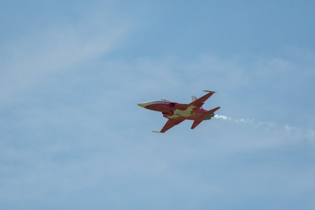 Mollis, Switzerland, August 18, 2023 Patrouille Suisse Northrop F-5E Tiger II military jet doing acrobatic flights during an air displayのeditorial素材