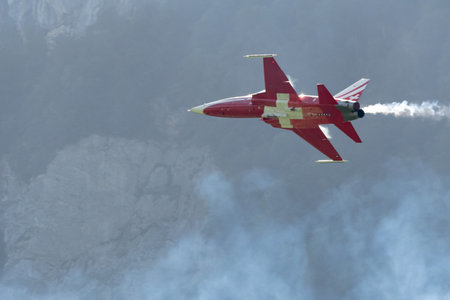 Mollis, Switzerland, August 18, 2023 Patrouille Suisse Northrop F-5E Tiger II military jet doing acrobatic flights during an air displayのeditorial素材