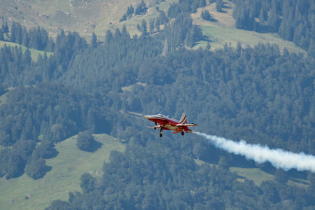 Mollis, Switzerland, August 18, 2023 Patrouille Suisse Northrop F-5E Tiger II military jet doing acrobatic flights during an air displayのeditorial素材
