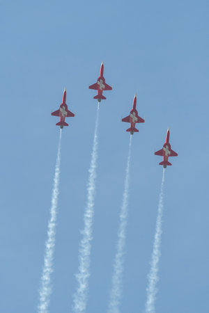 Mollis, Switzerland, August 18, 2023 Patrouille Suisse Northrop F-5E Tiger II military jet doing acrobatic flights during an air displayのeditorial素材
