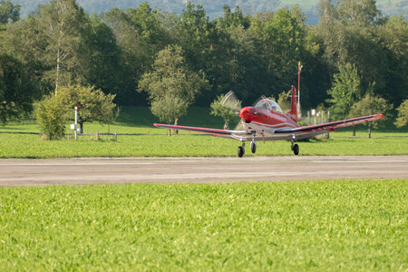 Mollis, Switzerland, August 18, 2023 Pilatus PC-7 aircraft is departing from runway 19のeditorial素材