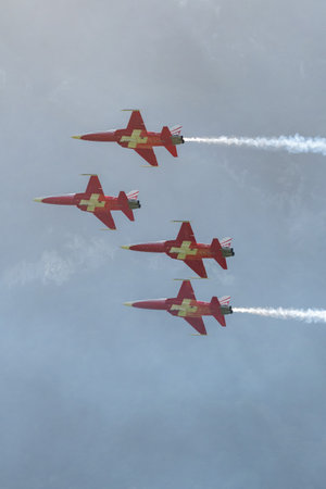 Mollis, Switzerland, August 18, 2023 Patrouille Suisse Northrop F-5E Tiger II military jet doing acrobatic flights during an air displayのeditorial素材