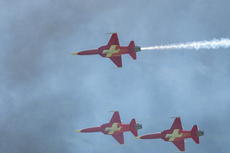 Mollis, Switzerland, August 18, 2023 Patrouille Suisse Northrop F-5E Tiger II military jet doing acrobatic flights during an air displayのeditorial素材