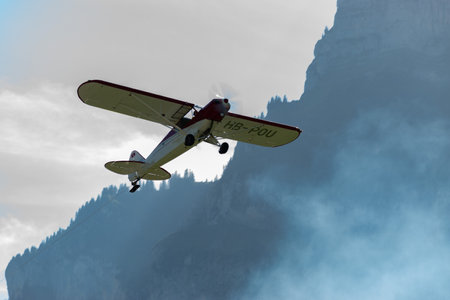 Mollis, Switzerland, August 18, 2023 HB-POU Piper PA-18 Super Cub aircraft is taking off from runway 01のeditorial素材