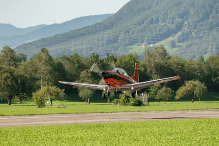 Mollis, Switzerland, August 18, 2023 Pilatus PC-7 aircraft is departing from runway 19のeditorial素材