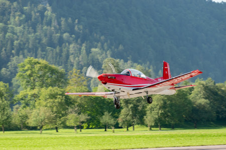 Mollis, Switzerland, August 18, 2023 Pilatus PC-7 aircraft is departing from runway 19のeditorial素材