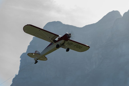 Mollis, Switzerland, August 18, 2023 HB-POU Piper PA-18 Super Cub aircraft is taking off from runway 01のeditorial素材