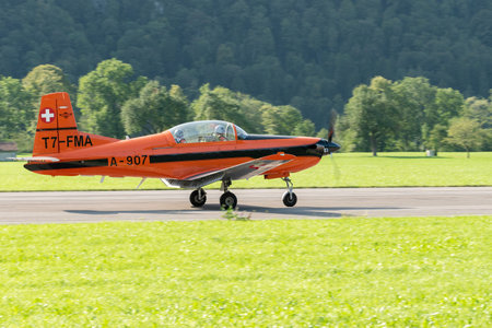 Mollis, Switzerland, August 18, 2023 Pilatus PC-7 aircraft is taxiing along the runwayのeditorial素材