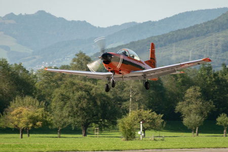 Mollis, Switzerland, August 18, 2023 Pilatus PC-7 aircraft is departing from runway 19のeditorial素材