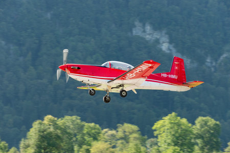 Mollis, Switzerland, August 18, 2023 Pilatus PC-7 aircraft is departing from runway 19のeditorial素材