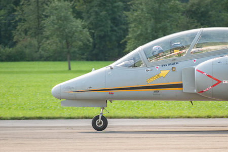 Mollis, Switzerland, August 18, 2023 I-MJET SIAI 211 aircraft is taxiing on the runwayのeditorial素材