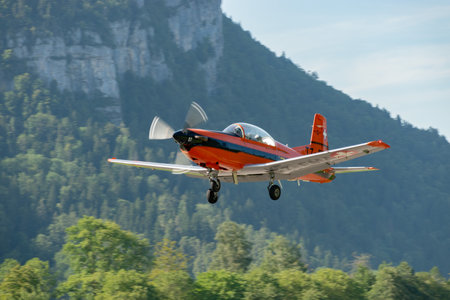 Mollis, Switzerland, August 18, 2023 Pilatus PC-7 aircraft is departing from runway 19のeditorial素材