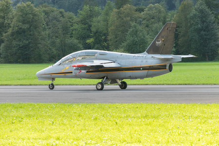 Mollis, Switzerland, August 18, 2023 I-MJET SIAI 211 aircraft is taxiing on the runwayのeditorial素材