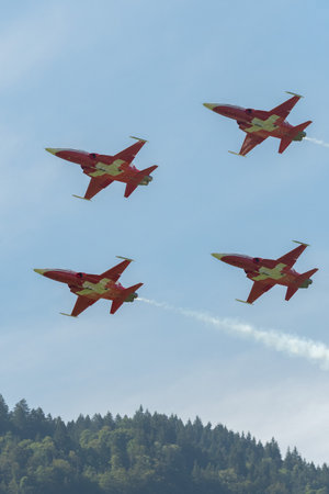 Mollis, Switzerland, August 18, 2023 Patrouille Suisse Northrop F-5E Tiger II military jet doing acrobatic flights during an air displayのeditorial素材