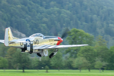Mollis, Switzerland, August 18, 2023 D-FPSI North american P-51D Mustang is taking off from runway 01のeditorial素材
