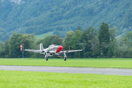 Mollis, Switzerland, August 18, 2023 D-FPSI North american P-51D Mustang is taking off from runway 01のeditorial素材