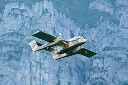 Mollis, Switzerland, August 18, 2023 F-AZKM SIAI North american OV-10B Bronco is performing during an air displayのeditorial素材