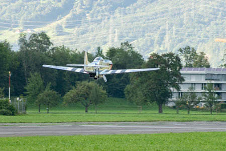 Mollis, Switzerland, August 18, 2023 D-FPSI North american P-51D Mustang is taking off from runway 01のeditorial素材