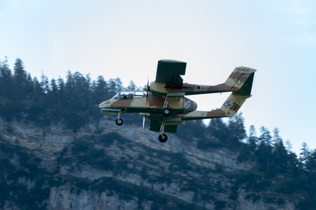 Mollis, Switzerland, August 18, 2023 F-AZKM SIAI North american OV-10B Bronco is performing during an air displayのeditorial素材