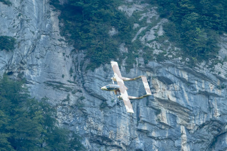 Mollis, Switzerland, August 18, 2023 F-AZKM SIAI North american OV-10B Bronco is performing during an air displayのeditorial素材