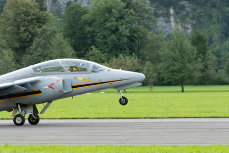 Mollis, Switzerland, August 18, 2023 I-MJET SIAI 211 aircraft is landing on runway 01のeditorial素材