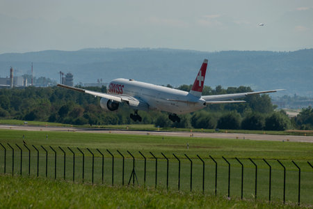 Zurich, Switzerland, September 6, 2023 HB-JNB Swiss international airlines Boeing 777-3DEER aircraft on its final approach to runway 14のeditorial素材